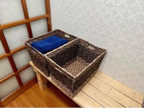 a basket sitting on a table in a room at さくらの宿Traditional Japanese house with cherry blossoms in Hasunuma