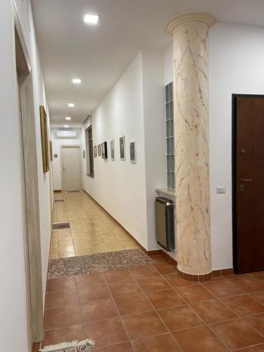 a hallway with a column in a building at B&B da Nonna Teresa in Baronissi