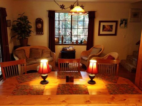 a living room with a table with two lamps on it at Sweet Retreat: Theater, Pool/Ping-Pong, Quiet! in Camp Connell
