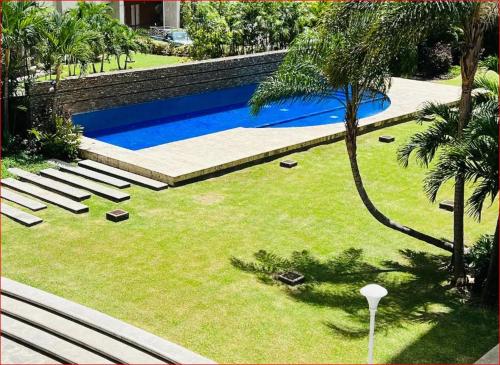 an overhead view of a swimming pool in a yard at Brand new apt San Bernardino Caracas in Caracas