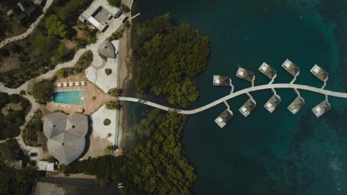 an aerial view of a bridge over the water at Menjaga Bay in Labuan Bajo