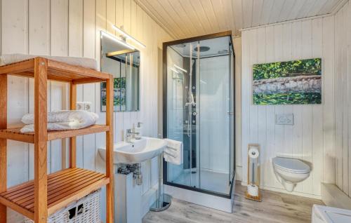 a bathroom with a shower and a sink and a toilet at 2 Bedroom Beautiful Home In Wandlitz Ot Zerpenschleuse in Berg