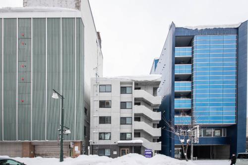 a group of buildings in a city with snow at ASTRAL【2min from Asahikawa sta】 in Asahikawa