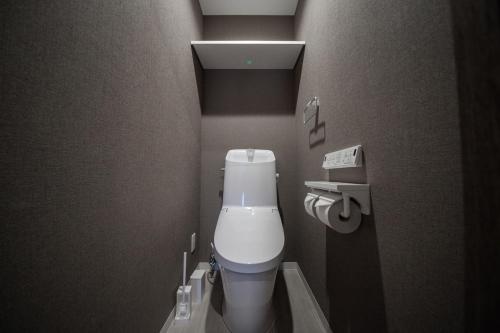 a small bathroom with a white toilet in a room at ASTRAL【2min from Asahikawa sta】 in Asahikawa