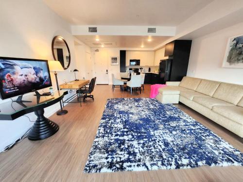 a living room with a couch and a table at Cityscape Luxury Rental Homes in the Heart of Los Angeles in Los Angeles