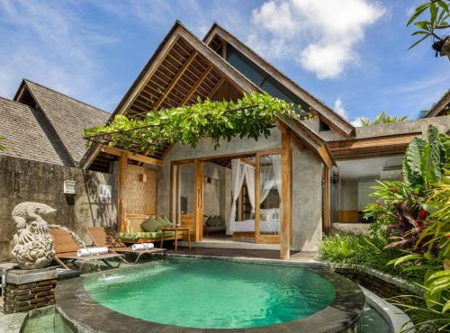 a pool in the backyard of a villa at Wana Bucu Villas by GenuineHost in Ubud