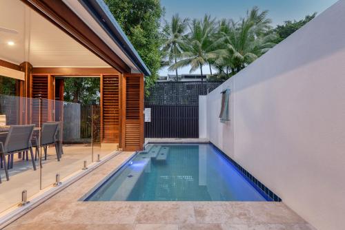 a swimming pool in the backyard of a house at Villa 3 @ Chez Willow, 2 mins to Four Mile Beach in Port Douglas
