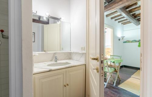 a bathroom with a sink and a mirror at 1 Bedroom Nice Apartment In Recco in Recco