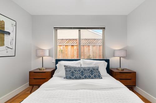 A bed or beds in a room at @ Marbella Lane - Immaculate & Cozy 3BR Home