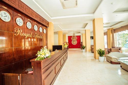 a lobby of a hotel with clocks on the wall at Royal Hotel Ninh Bình in Ninh Binh