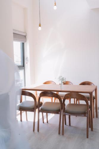 a dining room with a table and chairs at Canary Dalat Hotel in Da Lat