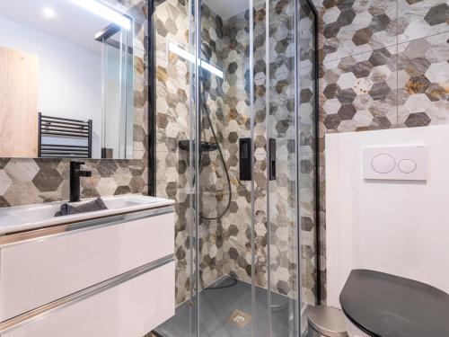 a bathroom with a shower with a toilet and a sink at Appartement Avoriaz, 5 pièces, 8 personnes - FR-1-314-241 in Morzine