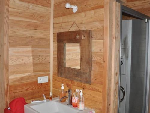 a bathroom with a sink and a mirror at Chalet Vars, 6 pièces, 12 personnes - FR-1-773-13 in Vars