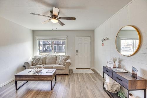 a living room with a couch and a ceiling fan at Grand Junction Vacation Rental Near University! in Grand Junction