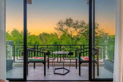 a view of a balcony with a table and chairs at Angkor Rithy Residence team in Siem Reap