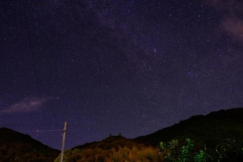 a starry night with the milky way at 四万十川傍にある日本家屋まるごと「貸切宿　ほとり」 in Shimanto
