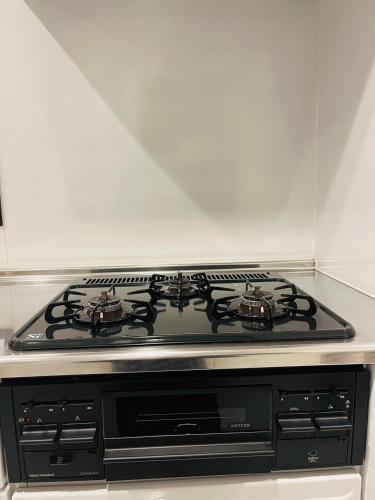 Dapur atau dapur kecil di 奥武島の浅築マンション 1フロア貸し切り BBQ可能 短い橋で島へアクセス テラスで海を楽しむ coco アイランド