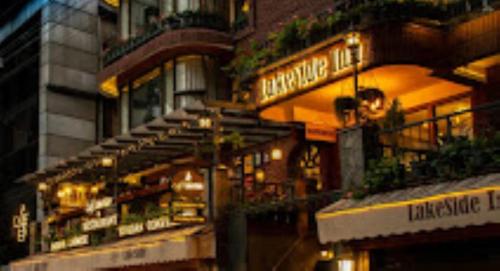 a building with lights on the side of it at Hotel H. K. Legacy Nainital in Nainital