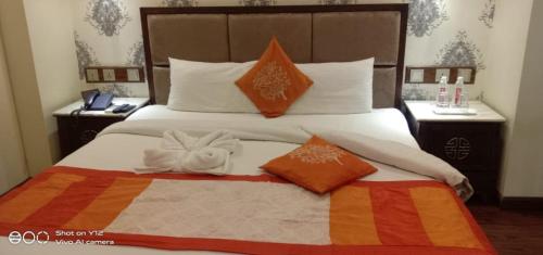 En eller flere senge i et værelse på Hotel Divinity by Audra Hotels , Mathura