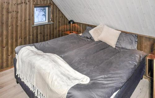 a bedroom with a large bed in a attic at Gorgeous Home In Sysslebck With Wifi in Sysslebäck