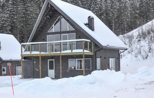 a house in the snow with snow at Awesome Home In Sysslebäck With Sauna in Sysslebäck