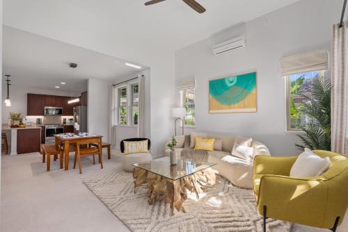 a living room with a couch and a table at @Marbella Lane-Pōmaika'i LoveNest Ocean+MT View in Waianae