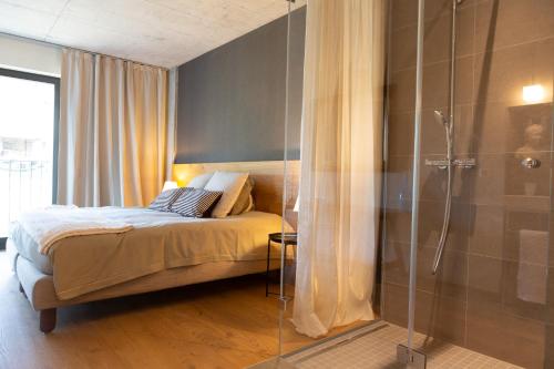 Postel nebo postele na pokoji v ubytování Hotel de l’Ours Preles
