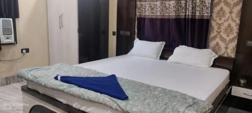 Cama o camas de una habitación en Hotel Atithi