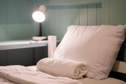 Una cama o camas en una habitación de Relaxing 5B2BHome w Parking Walk to Brisbane River