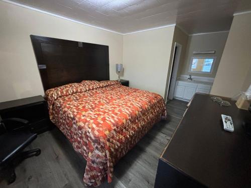 Postel nebo postele na pokoji v ubytování Cook's Motel- Panama City Beach