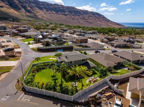 an aerial view of a town with houses and the ocean at @Marbella Lane-Pōmaika'i LoveNest Ocean+MT View in Waianae