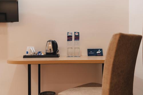 a table in a room with a coffee maker on it at Zip By Spree Hotels Gangtok in Gangtok