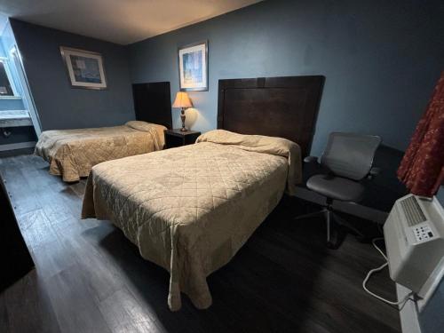 Postel nebo postele na pokoji v ubytování Cook's Motel- Panama City Beach