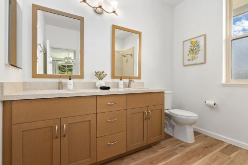 a bathroom with a sink and a toilet at @Marbella Lane-Pōmaika'i LoveNest Ocean+MT View in Waianae