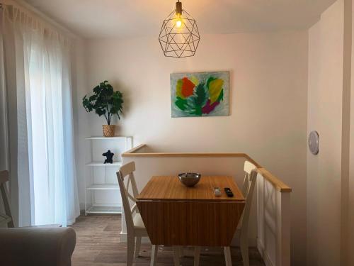 a dining room with a table and a potted plant at Home SEA&DREAMS OldTown V in Calpe