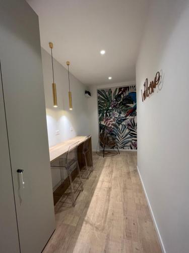 a dining room with a table and a mural on the wall at Calari Rooms - Affittacamere in Bologna