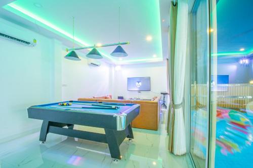 a living room with a pool table in it at V Pool Villa Sattahip in Sattahip