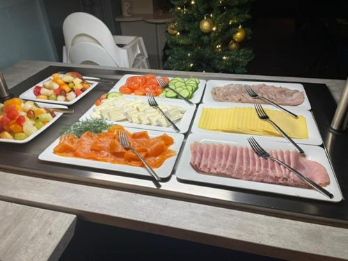 a tray filled with different types of food on a table at De Watersport Heeg in Heeg