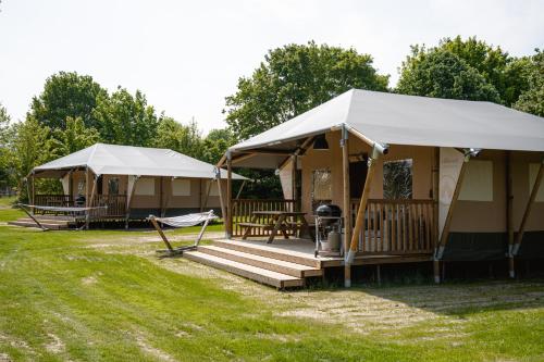 a couple of tents in a field at Glamping Borken in Borken