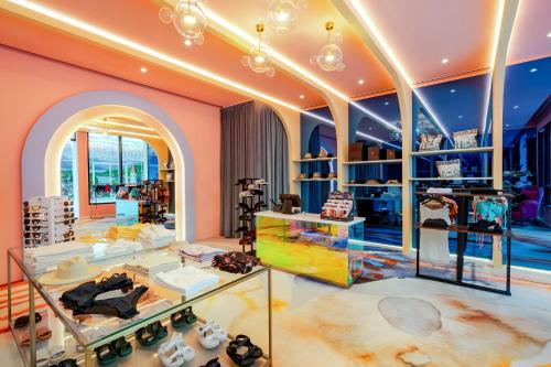 a fashion store with a lot of shoes on display at voco Dubai Monaco, the Heart of Europe by IHG in Dubai