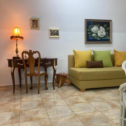 a living room with a couch and a table at Lucky Suites in Rethymno Town