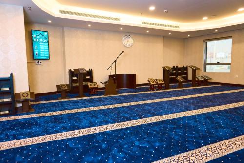 a large room with a stage and a stage at Selat Al Bait Hotel in Makkah