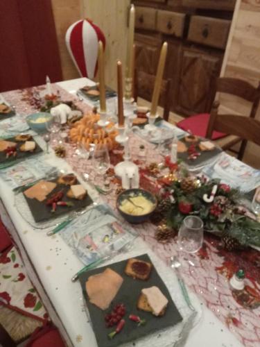 a table full of food and decorations on it at La grande fistoire d'Annie 