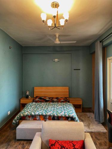 Un pat sau paturi într-o cameră la Aqua Inn - Studio Apartment