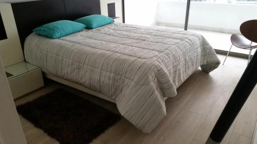 מיטה או מיטות בחדר ב-Apartment Cerro Colorado