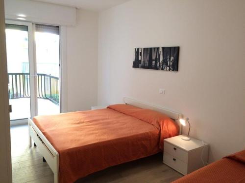 Ein Bett oder Betten in einem Zimmer der Unterkunft RESIDENCE PANFILO - WALTERIGATO Apartments SOLO PER FAMIGLIE
