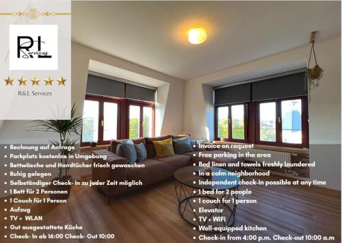 een woonkamer met een bank en een aantal ramen bij Cozy Apartment near city center Dresden by R&L in Dresden