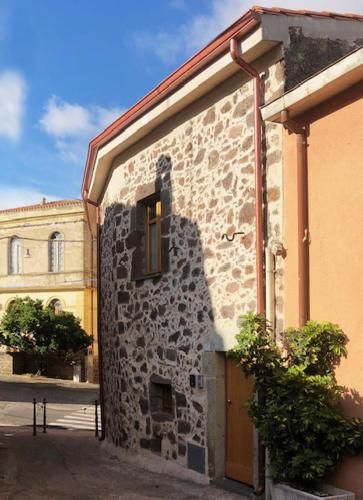 a stone building with a window on the side of it at Ferienwohnung Chiara in Seneghe