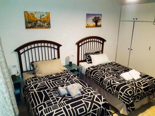 Ένα ή περισσότερα κρεβάτια σε δωμάτιο στο Wanjara's Nest