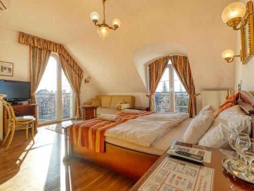 Postel nebo postele na pokoji v ubytování Villa Panoráma